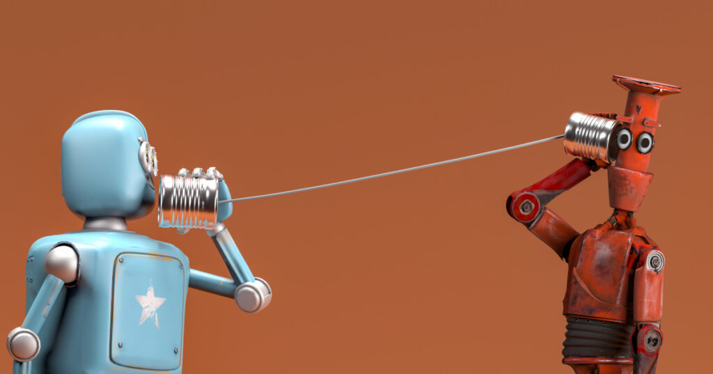 Robotti soittaa toiselle peltisellä purkkipuhelimella. Vastaanottaja näyttää hölmistyneeltä.